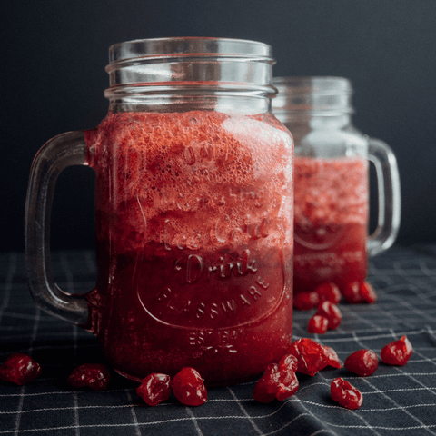 red berry juice smoothies in mason jars