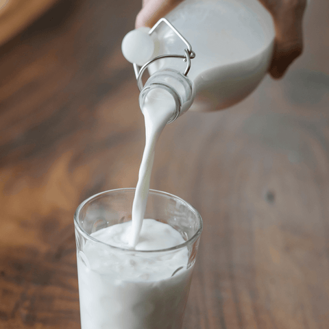 milk being poured into glass