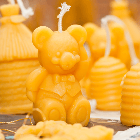 various beeswax candles in multiple forms such as teddybear