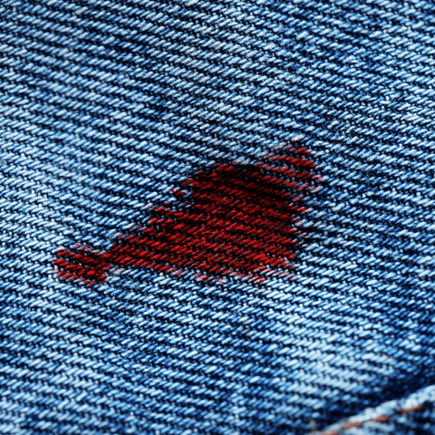 red blood stain in blue denim