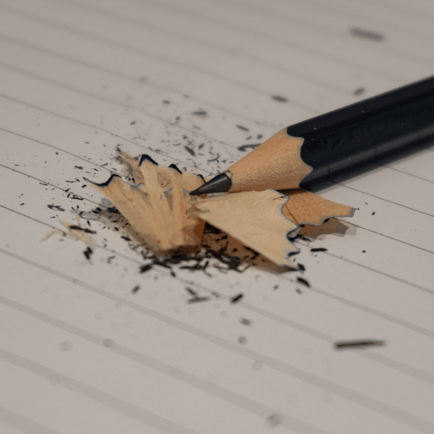 pencil sharpenings on lined paper