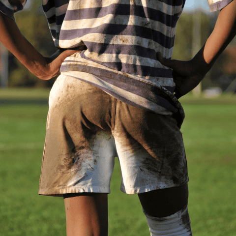 game players backside of uniform covered in fresh mud