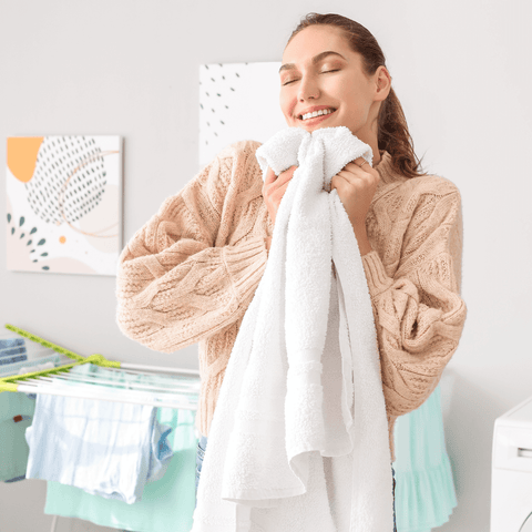 women enjoying feeling of soft laundry with laundry conditioner sheets GreenSheets